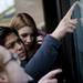 Sixteen-year-old Anabel Cruz searches for her friend's brother's name on the Community High School lottery list on Tuesday, Feb. 12. Daniel Brenner I AnnArbor.com